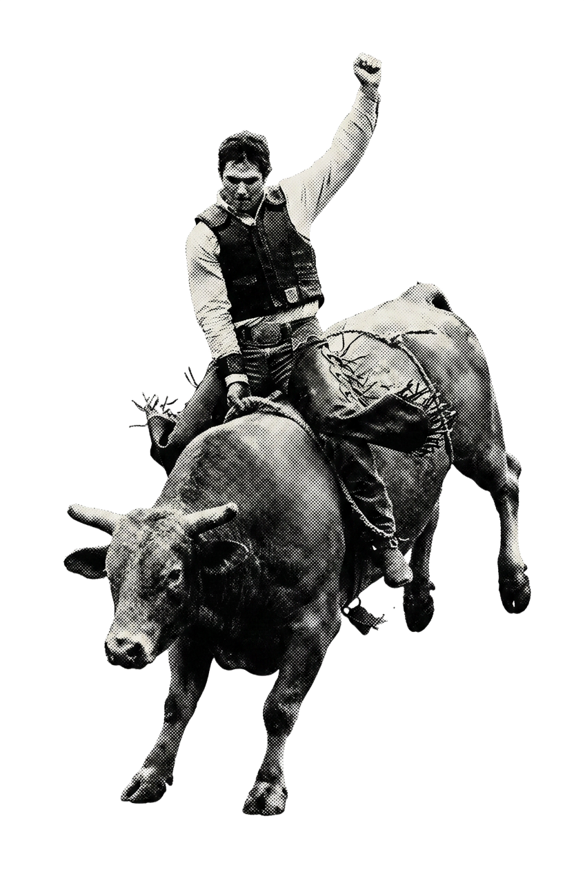 A bull rider holding on with one fist raised